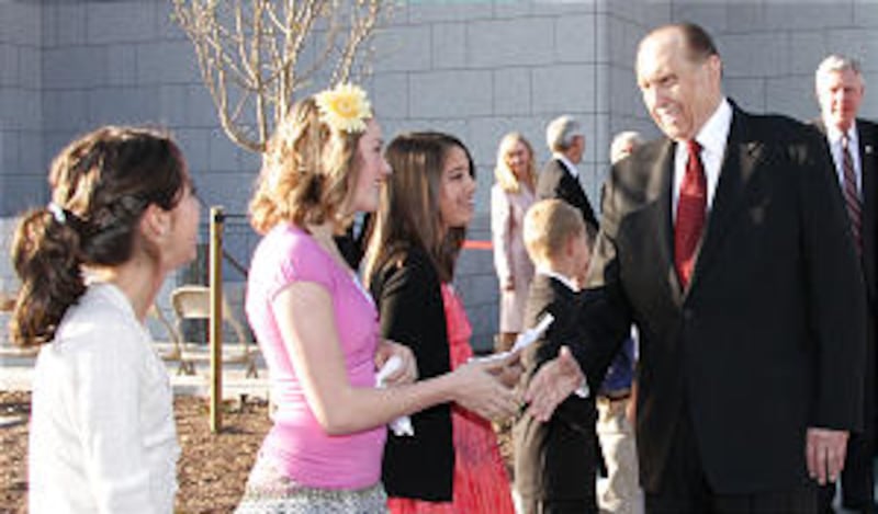 President Thomas S. Monson pauses before entering the Draper temple to shake the hands of these youn