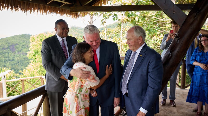 Elder Ronald A. Rasband of the Quorum of the Twelve Apostles, center right, joins Elder Evan Healy and Sister Marie Healy, senior missionaries serving in Seychelles, center; and Elder Thierry K. Mutombo, General Authority Seventy and president of the Africa Central Area, left, in Seychelles on Oct. 28, 2025.