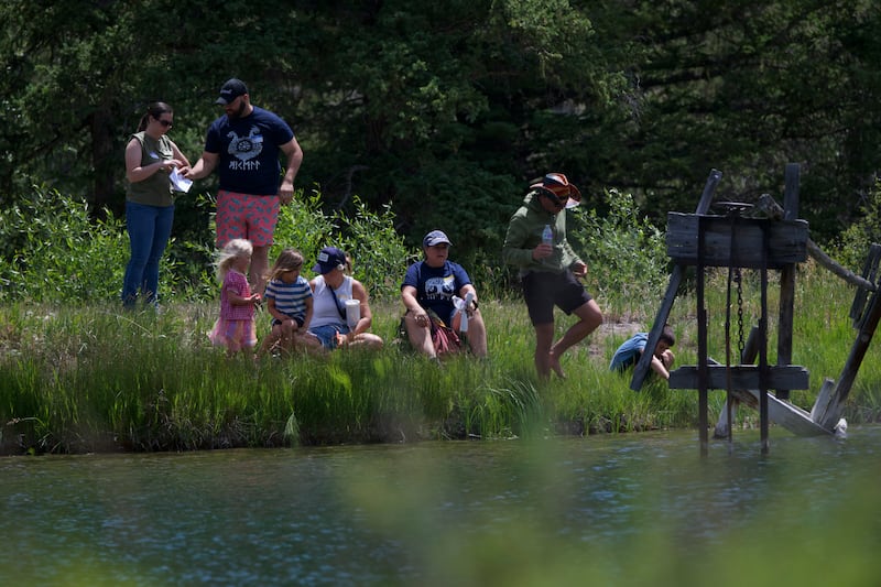 Members of the Abinadi and Hannah Seely Olsen family play by a pond at a family reunion on Saturday, July 4, 2026, in Joe's Valley, Utah.