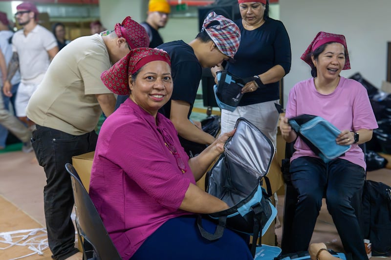 Volunteers from The Church of Jesus Christ of Latter-day Saints assemble food kits during a service project with friends and neighbors of the Sikh community in Dubai, United Arab Emirates, on Friday, Aug. 21, 2026.