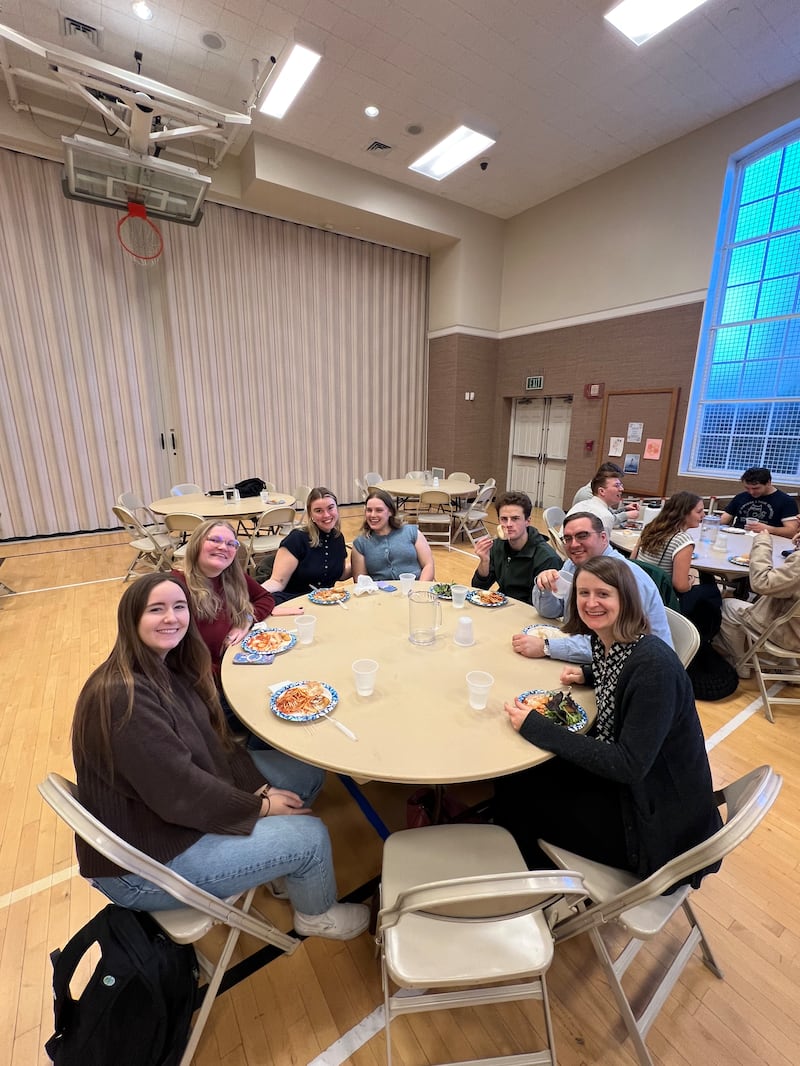 Young single adults eat dinner at the Cambridge Massachusetts Institute of Religion building on Wednesday, March 25, 2026.