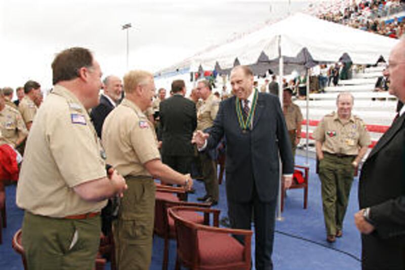 President Thomas S. Monson shakes hands with Las Vegas Area Council exectuvie Phil Bevins, one of th