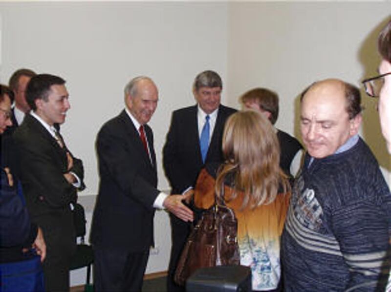 Elder Russell M. Nelson poses with members following the dedication of the Voronezh Branch meetingho