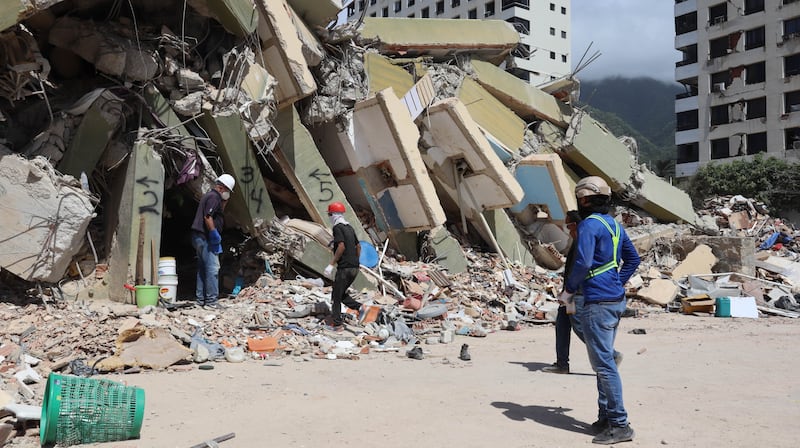 Workers search through rubble in La Guaira, Venezuela, on June 29, 2026.