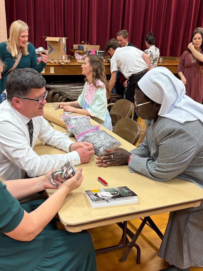 Sister Rosemary Nyirumbe talks with members of the Norman Oklahoma Stake during a service project for the Sewing Hope foundation on March 8, 2026, in Norman, Oklahoma.