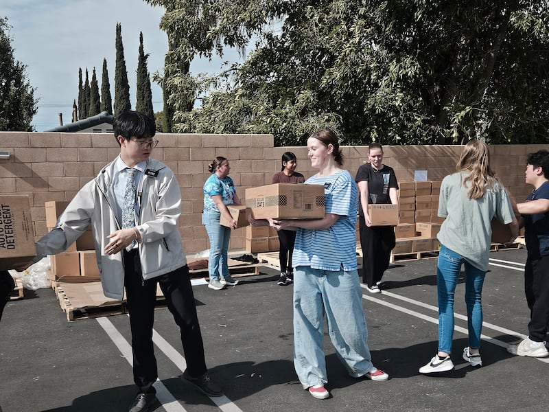 Volunteers unload boxes of food donated by The Church of Jesus Christ of Latter-day Saints in Yorba Linda, California, on Thursday, Feb. 5, 2026. A semitruck full of food was delivered to several food banks as part of a larger donation to 250 food banks across the country in celebration of the 250th anniversary of the United States.