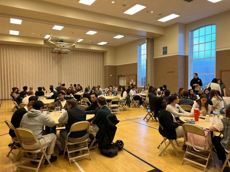Young single adults eat dinner at the Cambridge Massachusetts Institute of Religion building on Wednesday, March 25, 2026.