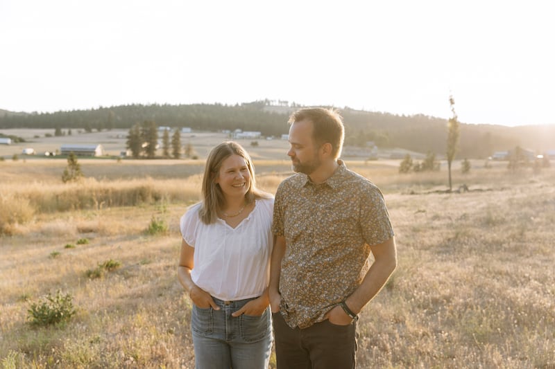 Lindsey and Matt Coons stand outside their home in Spokane, Washington, on Saturday, Aug. 22, 2026.