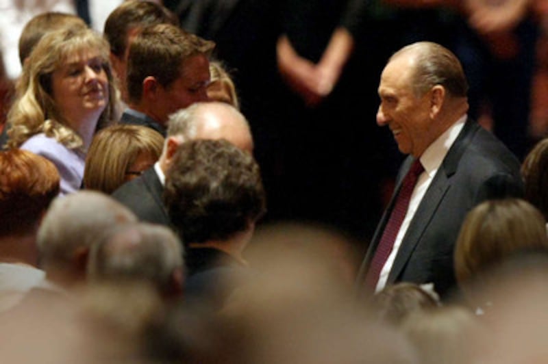 President Thomas S. Monson is greeted as he makes his way to his seat in the Conference Center.