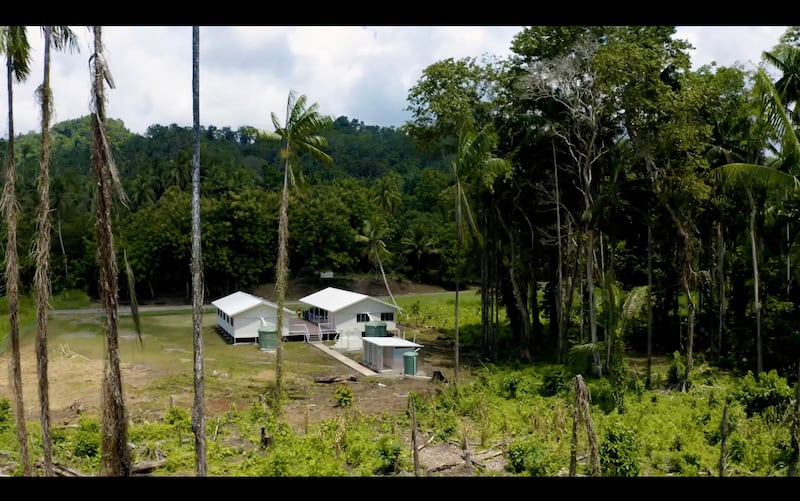 A simplified meetinghouse in Papua New Guinea equipped with solar panels and satellite internet enables congregations to gather, study and participate in Church programs in remote areas.
