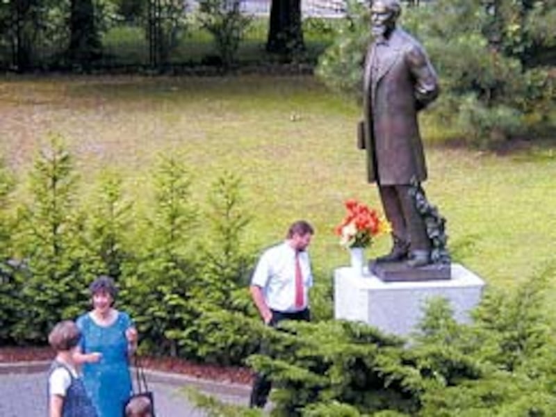 Larger-than-life bronze statue of Karl G. Maeser placed near Dresden Stake Center.