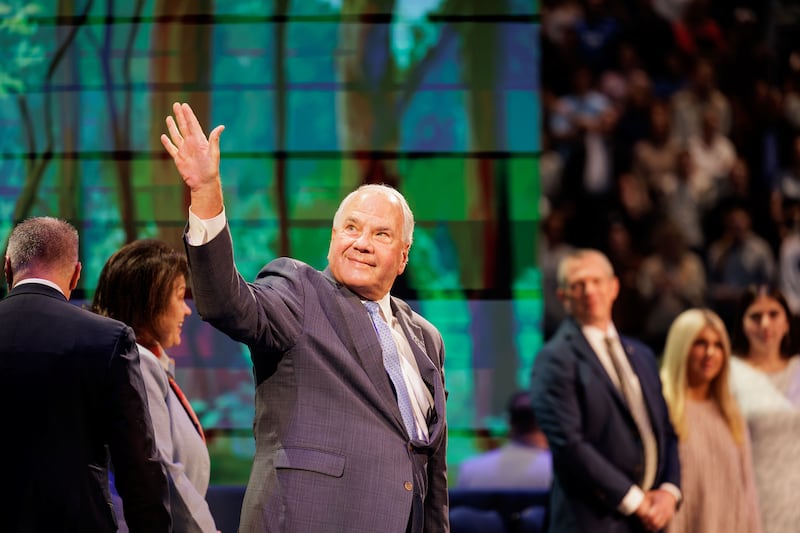 Elder Ronald A. Rasband of the Quorum of the Twelve Apostles waves as he enters the BYU Marriott Center in Provo, Utah, on Tuesday Oct. 27, 2026.