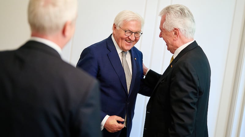 German Federal President Frank-Walter Steinmeier, center, speaks with President Dieter F. Uchtdorf, acting president of the Quorum of the Twelve Apostles..