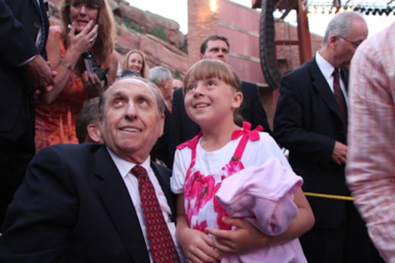 President Thomas S. Monson and McKenzie Miller wait for her mother to take their photo during interm