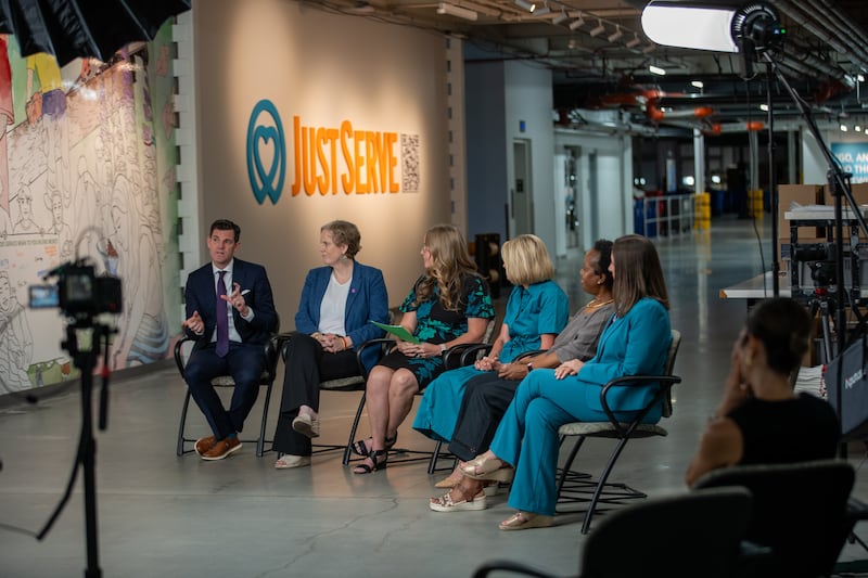 A panel speaks at the Humanitarian Center in Salt Lake City for the Church News podcast.