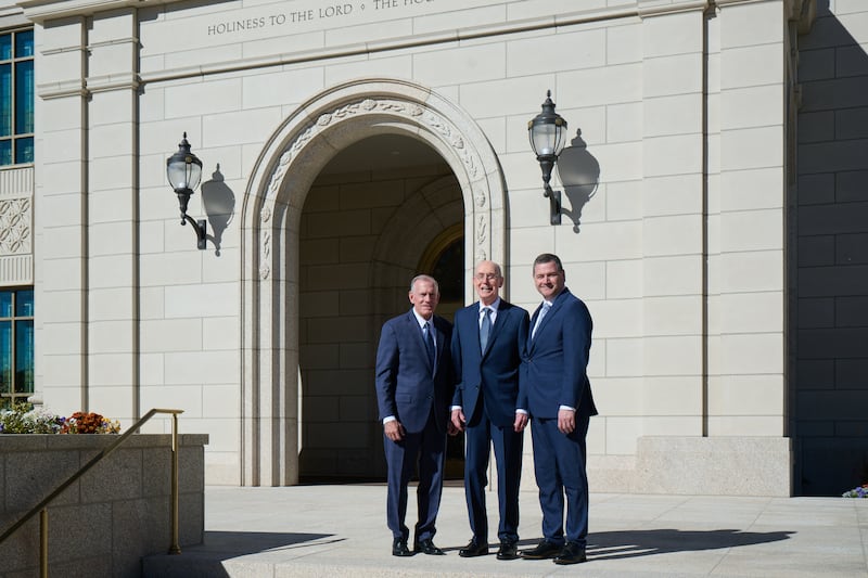 President Henry B. Eyring stands in front of the Montpelier Idaho Temple between General Authority Seventies Elder Steven R. Bangerter, left, and Elder Ricardo P. Giménez, right.