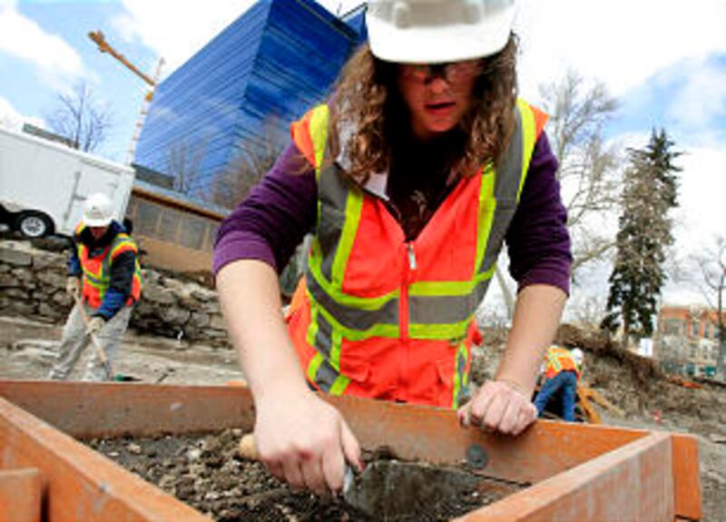 BYU student, Michaela Miller sifts the dirt looking for anything from the old tabernacle site. Worke