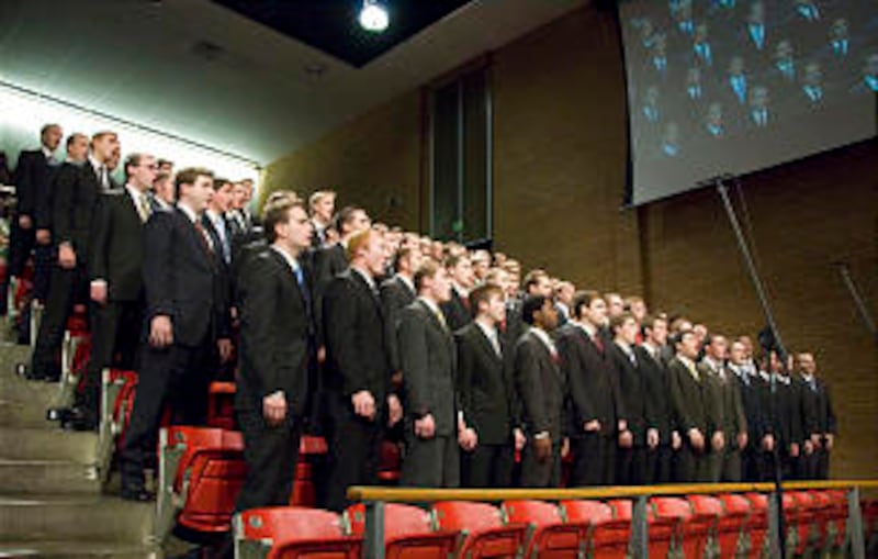 A men's chorus performs during BYU-Idaho's weekly devotion.