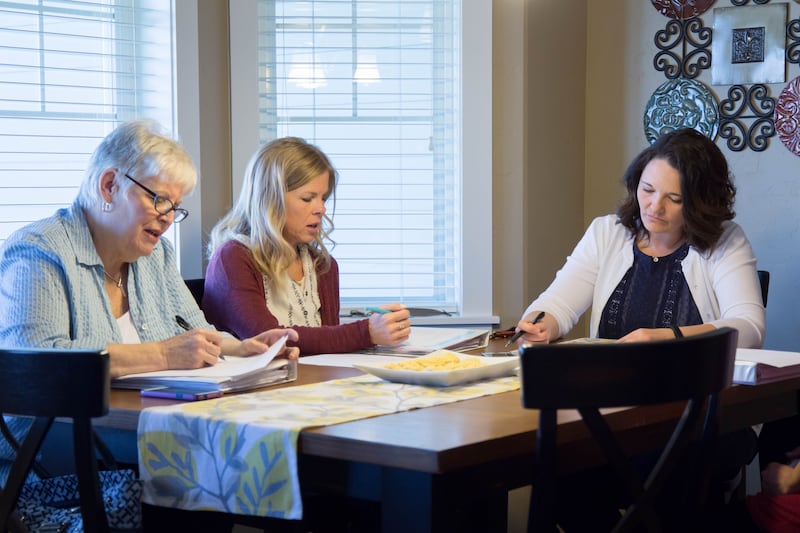 A Relief Society presidency meets together.
