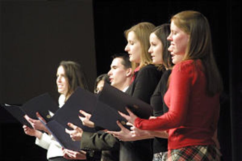 Turned to their fathers, family history lab teaching assistants perform musical number "Hand in Hand
