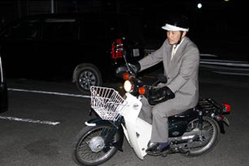 Ichinoseki Branch President Koki Yamasaki traveled by scooter to visit members in Kesennuma, Japan.