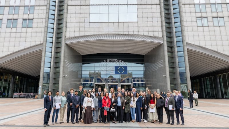 Participants of the Brussels Nexus meeting gather in front of the European Parliament in Brussels, Belgium, ahead of their visit on May 13, 2026.