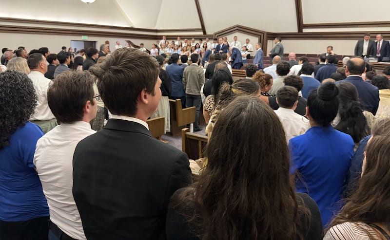 Youth stand before a devotional with Elder Clark G. Gilbert of the Quorum of the Twelve Apostles at the Schaumburg Illinois Stake Center in Chicago, Illinois on Sunday, Sept. 20, 2026.