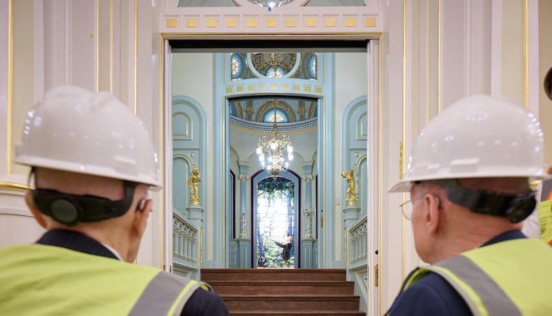 President Dallin H. Oaks, left, and President Henry B. Eyring, right, look at a stained-glass depiction of the First Vision in the Salt Lake Temple.