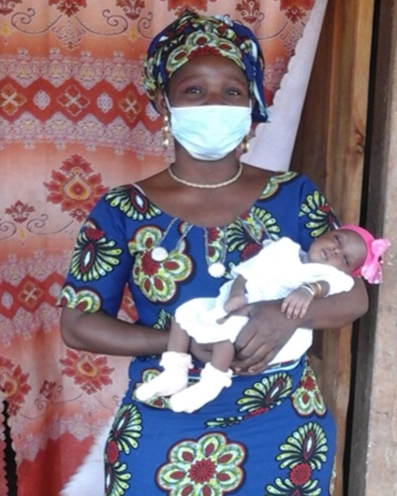 Clarisse holds her baby girl in Abomey, Benin, in West Africa