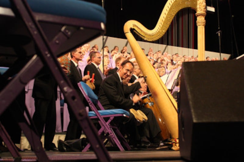 Mike Packham plays bongos with other percussionists in performing "Betelehemu " with the Tabernacle
