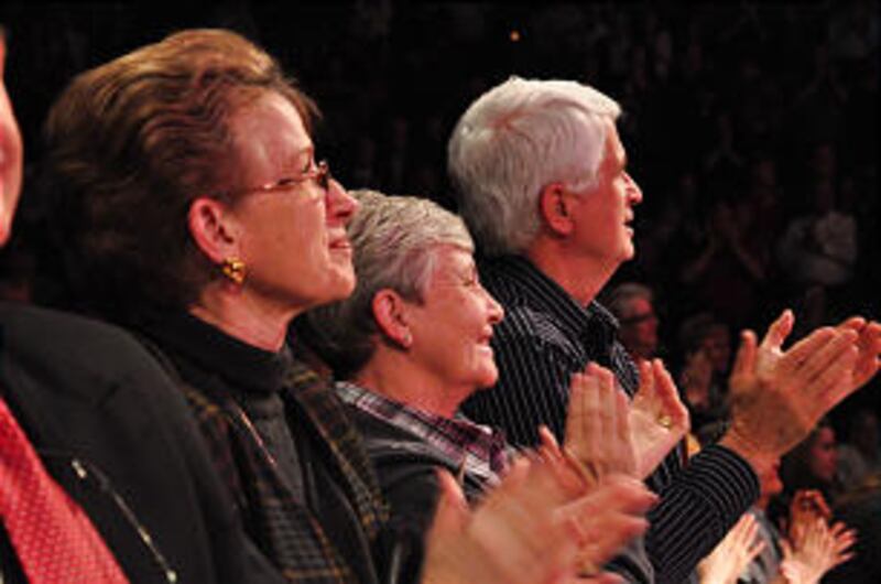 Audience members enjoy the concert by the Mormon Tabernacle Choir and Orchestra at Temple Square as