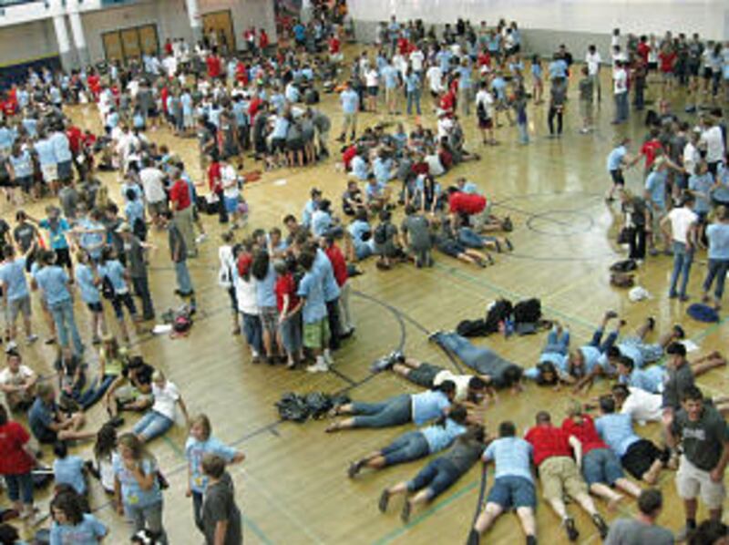 Youth conference participants from North and South Carolina enjoy a team building activity inside a