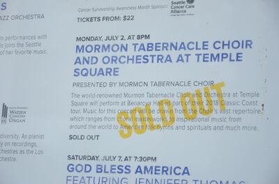 Sign outside Seattle’s Beneroya Hall announces a sold out show for the July 2 concert of the Mormon Tabernacle Choir and Orchestra at Temple Square.