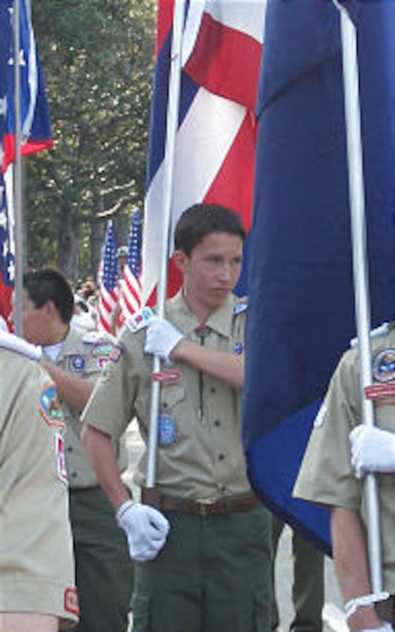 Jeffrey Dunn of the Santa Margarita California Stake carries a flag in the Tournament of Roses Parad