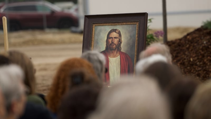A painting of the Lord Jesus Christ is positioned in front of the attendees of the groundbreaking ceremony for the Missoula Montana Temple.