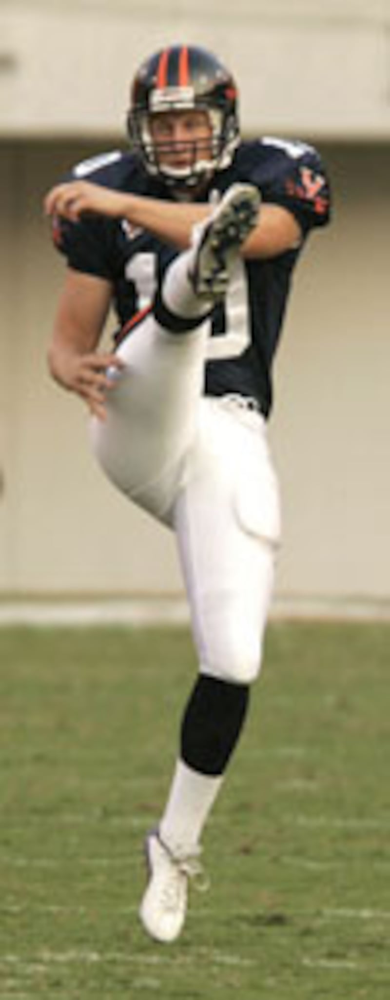UVa's Sean Johnson punts the ball Saturday, Sept. 11, 2004, during Virginia's 56-24 win over North C