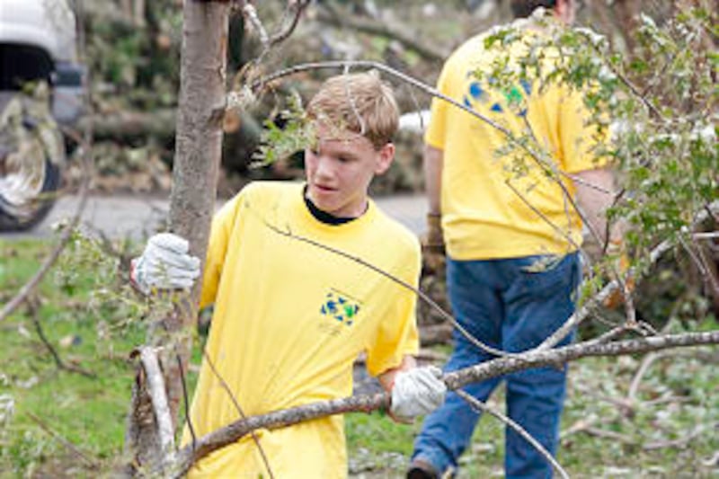 Volunteer works with 'Helping Hands' crew in Joplin, Mo. The crew filled 7,400 work orders May 28-29