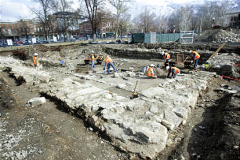 Workers uncover the original foundation for Provo's first tabernacle, a building known as the "old m