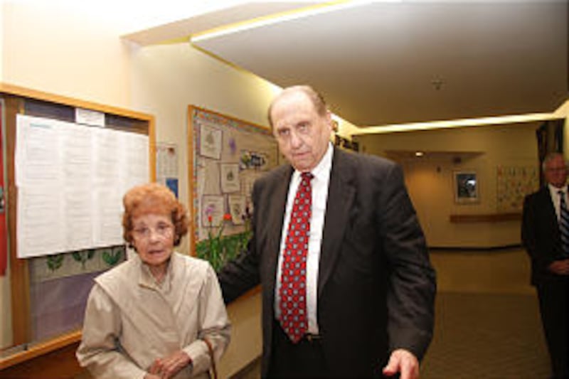While in Toronto on Sunday, June 26, President Thomas S. Monson accompanies Dorothy Davies to visit