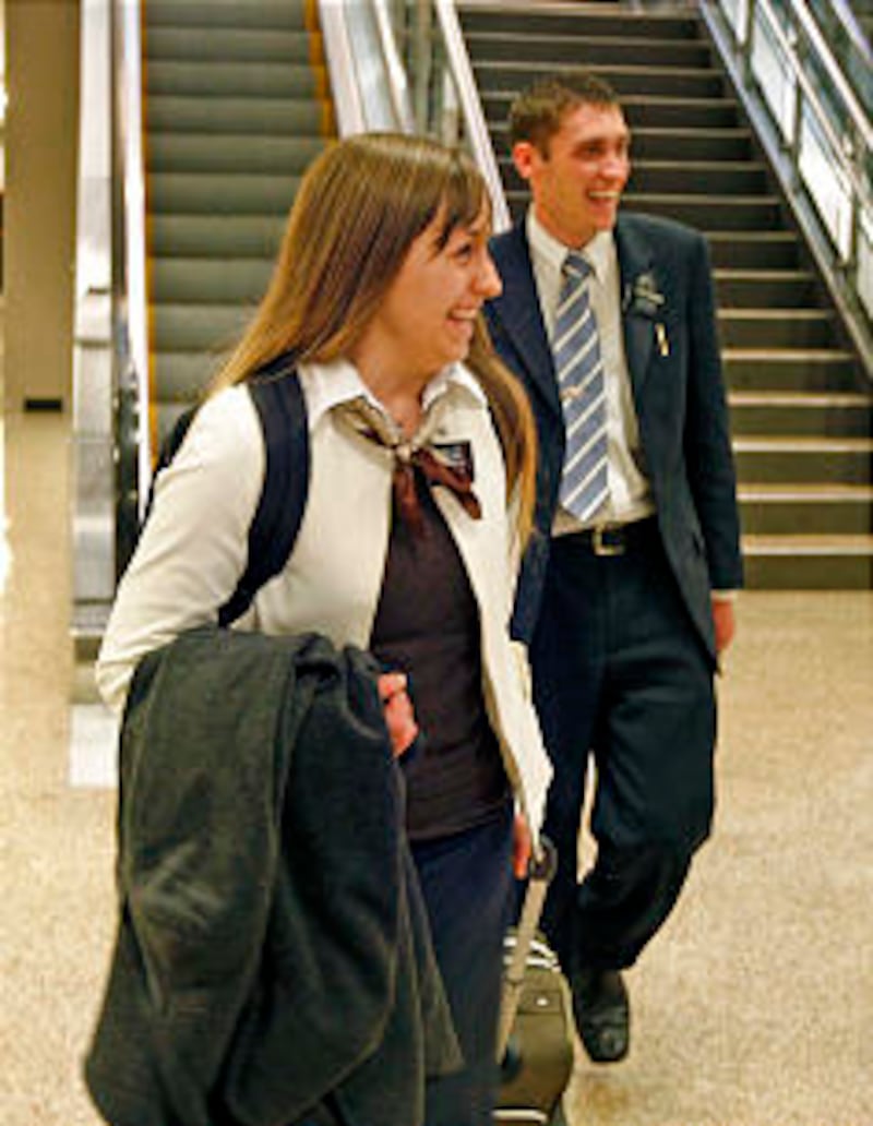 Sister Breanne Hawkins and her brother, Elder Kevin Hawkins, smile with delight as they approach the