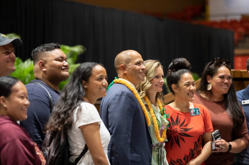 BYU–Hawaii President John S.K. Kauwe III and his wife, Sister Monica Kauwe, center, pose for a photo with others following a devotional in the Cannon Activities Center in Laie, Hawaii, on Tuesday, May 3, 2022.