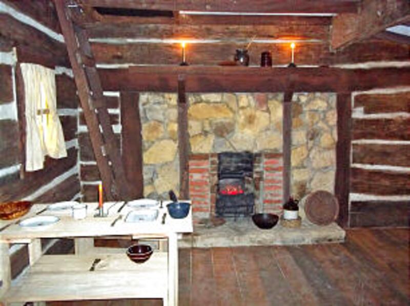 A log cabin room, crafted from original timber of a Mormon-era log cabin in Missouri, now stands as