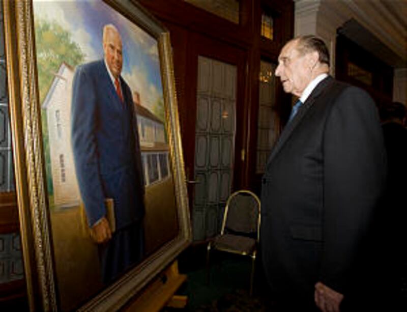 President Thomas S. Monson admires Ken Corbett's portrait of Wilford C. Wood unveiled at a recogniti