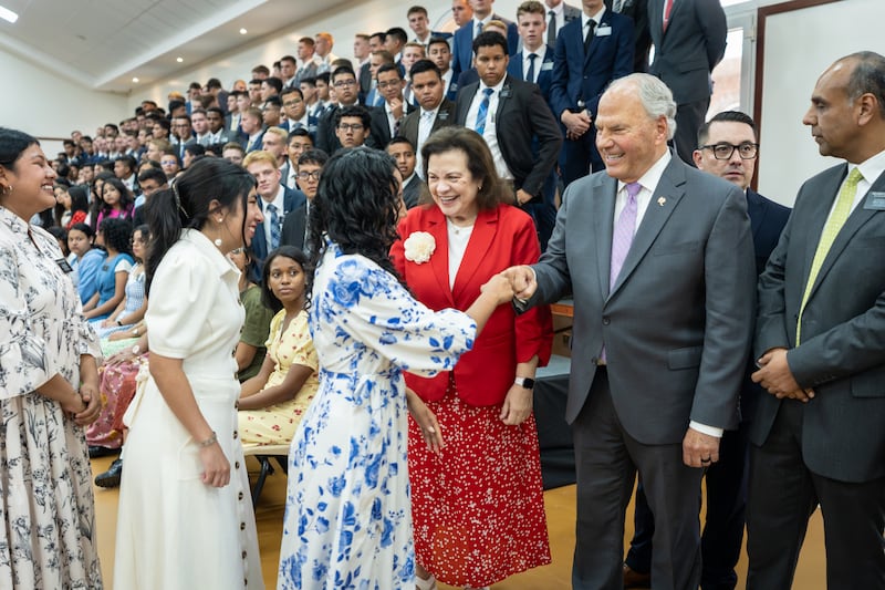 Elder Ronald A. Rasband of the Quorum of the Twelve Apostles and his wife, Sister Melanie Rasband, greet missionaries after a devotional in Managua, Nicaragua, on Friday, 16, 2026.