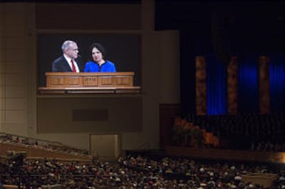 Brother Osguthorpe invites his wife, Sister Lolly Osguthorpe, to the podium to share her thoughts. S
