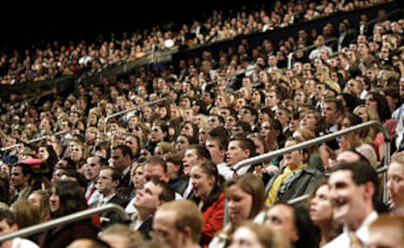 Young adults are among a capacity audience listening to Elder D. Todd Christofferson of the Quorum o