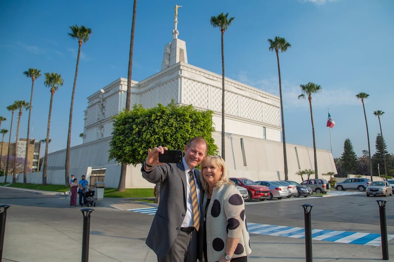 Elder Gary E. Stevenson of the Quorum of the Twelve Apostles takes a selfie with his wife, Sister Lesa Stevenson, in front of the Mexico City Mexico Temple.