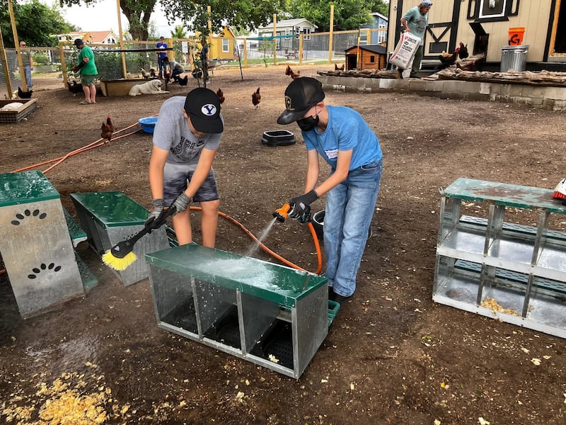 Youth of the Austin Texas Stake wash the facilities of the Community First! Village in recognition of annual Youth Service Day in Austin, Texas, on May 30, 2026.
