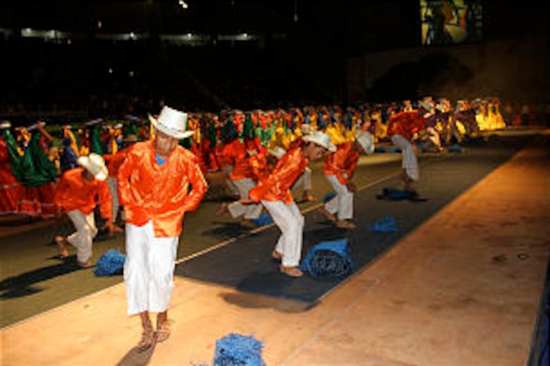 Young dancers don traditional costumes to perform folk dance that celebrates El Salvador's agrarian