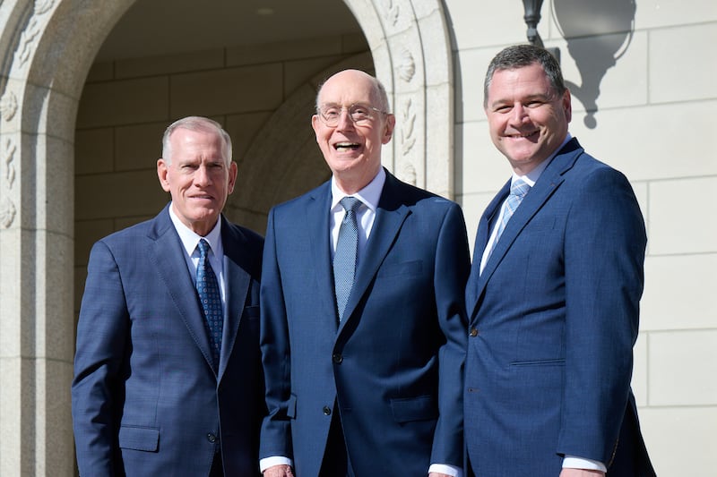 President Henry B. Eyring stands in front of the Montpelier Idaho Temple between General Authority Seventies Elder Steven R. Bangerter, left, and Elder Ricardo P. Giménez, right.